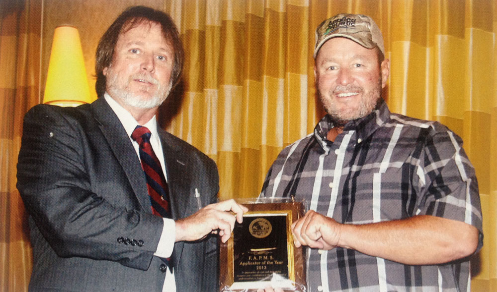 President Tim Harris presents the award to Mr. Tracy Wood