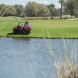 Treating shoreline grasses utilizing Honda ATV